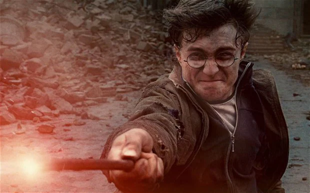 Harry, Ron, and Hermione amid the ruins of Hogwarts